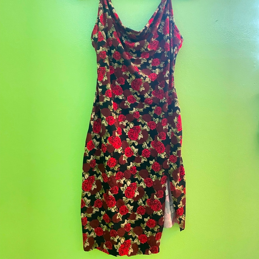 It’s a red dress with roses all over!